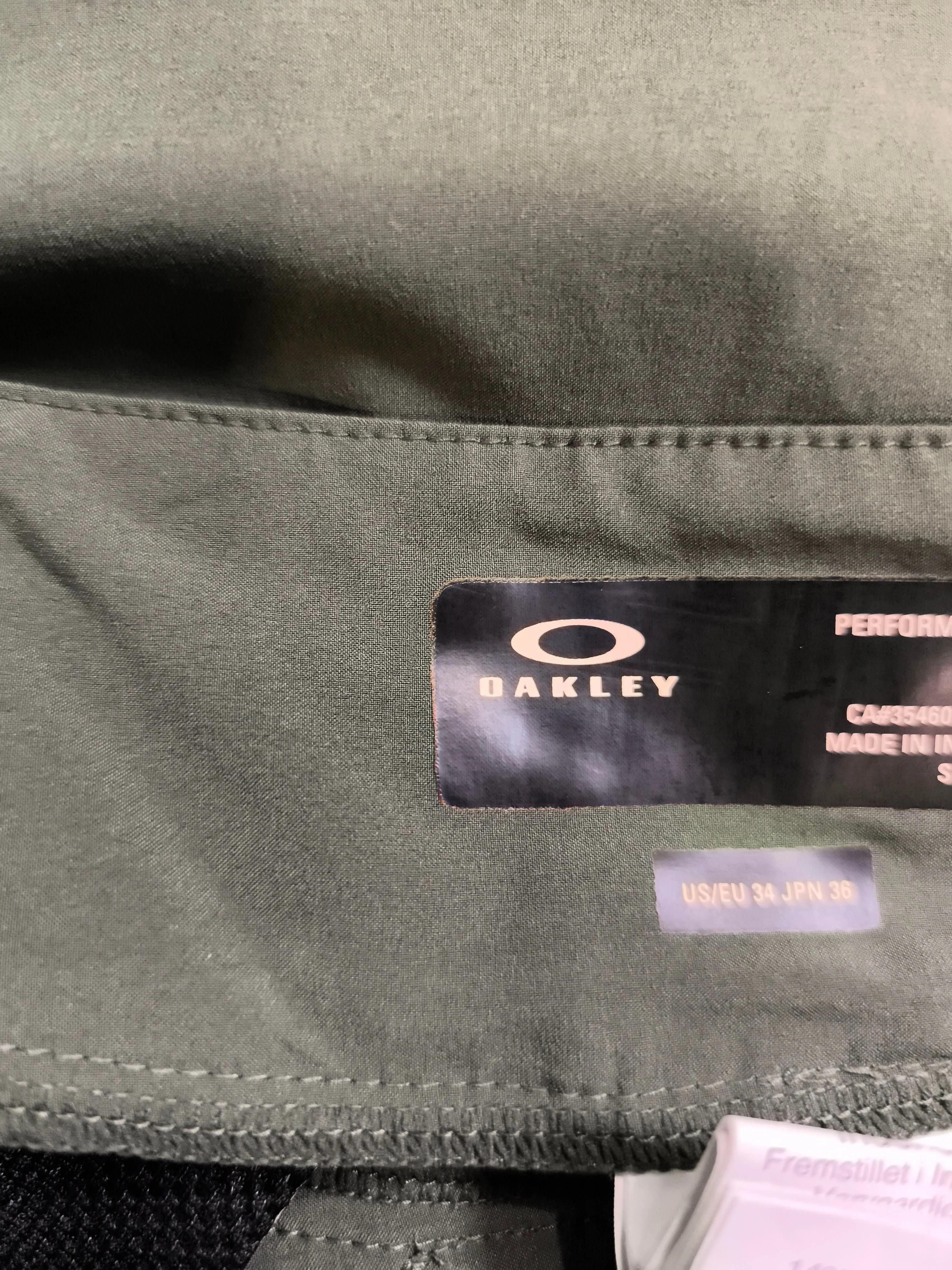 Oakley athletic swim trunks in green - Image 5